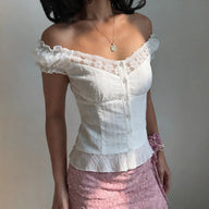 Blusa Diandra in pizzo francese con maniche a sbuffo